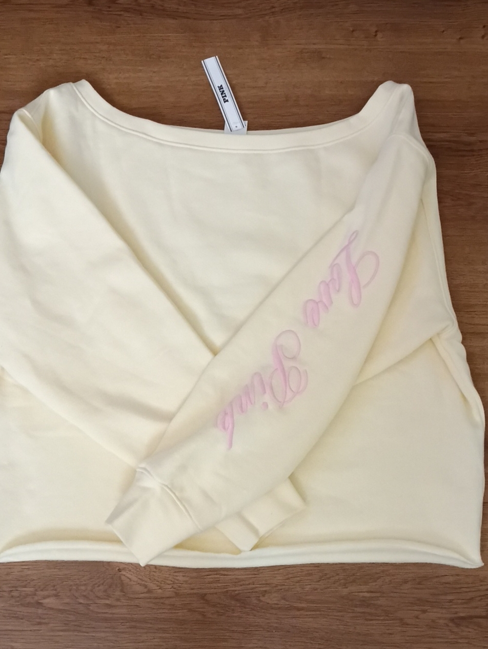 PINK Victoria's Secret Cream Off-Shoulder Sweatshirt with Pink Script on Sleeve